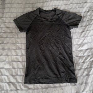 Size 0, lululemon black short sleeve, slightly cropped.